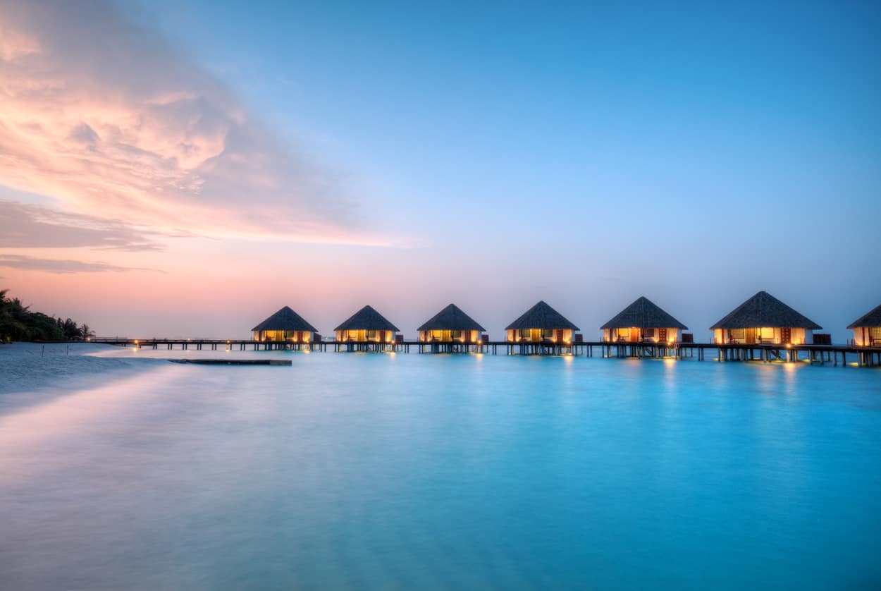 Beautiful Maldives sunset over water villas